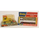 Two Dinky Toys diecast model vehicles Mercedes Benz Truck 940 and Shovel Dozer 977, both in original