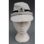 Japanese Navy officer's cap with anchor motif and two black stripes.