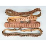 Four various 12 bore shotgun cartridge belts.