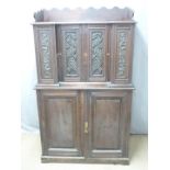 A carved breakfront cabinet on cabinet with an arrangement of twenty graduated drawers, W96 x D38