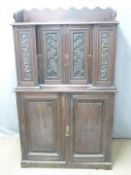 A carved breakfront cabinet on cabinet with an arrangement of twenty graduated drawers, W96 x D38