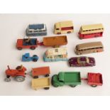 Twelve Corgi and Dinky Toys diecast model vehicles including buses, Field Marshal tractor,