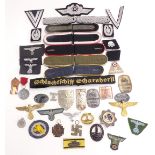 Replica Nazi German badges and insignia to include shoulder boards, Luftwaffe cap badge, U boat,