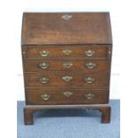 Georgian oak bureau with fitted interior with four graduated drawers raised on bracket feet, W76 x