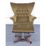 Retro G Plan upholstered button back armchair and matching footstool raised on X frames and metal