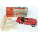 Victory Models 1:18 scale electric model Triumph TR2 Sports Car with red body and tan interior, in