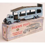 Two Dinky Toys diecast model vehicles Pullmore Car Transporter 582 and Army Scout Car 673 both in
