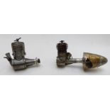 Two vintage compression ignition model aircraft engines, one AMCO the other FROG