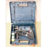 A cased Bosch GBH2000 professional electric drill, together with blades and a Draper Expert socket