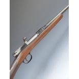 Unnamed .410 bolt-action shotgun with chequered grip and 24.5 inch barrel, overall length 111cm,