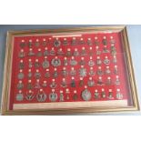 Seventy-four British Army WW1 Guards and Infantry cap badges displayed by order of precedence