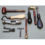 Nine various gun tools including nipple keys, powder and shot measures, bullet moulds, wad punch