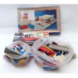 A collection of Lego including two sets Lego System Esso Filling Station (1958) and 1913 Cadillac (