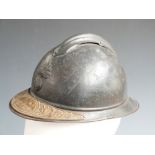 French WW1 Adrian helmet with liner and commemorative plaque to peak