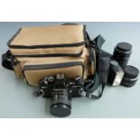 Praktica BC1 SLR camera with Carl Zeiss 1:2.4 f=35mm, 1:1.8 f=50mm and 4-5.6/70-210 lenses, flashgun