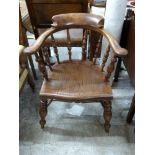 A 19thC elm seated smoker's bow chair, H78cm