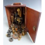 W.Watson & Sons Ltd microscope with travelling and rotating platform and further lenses below,