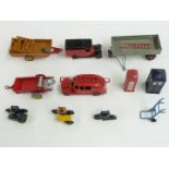 Ten Dinky Toys diecast model vehicles and accessories including Fire Engine, Royal Mail Van, AA