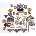 Replica mainly Nazi German badges and fabric insignia, to include enamel examples, Russian enamel