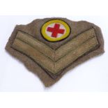 British Army WW1 era Royal Army Medical Corps insignia and corporal's chevrons cut from uniform