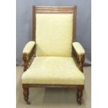 Large 19thC mahogany framed upholstered armchair raised on turned legs and castors, W72 x H104cm