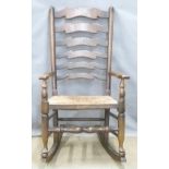 A rush seated ladderback rocking chair