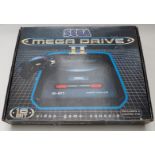 Sega Megadrive II video games console, in original box.