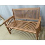 A teak or similar hardwood garden or conservatory bench, W126 x D60 x H 90cm