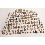 A collection of approximately 100 cap badges including Dorsetshire Regiment, North Irish Horse,