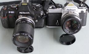 Two Nikon SLR cameras, comprising FE with Nikkor 50mm 1:1.4 lens and F-301 with Nikkor 35-105mm 1: