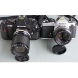 Two Nikon SLR cameras, comprising FE with Nikkor 50mm 1:1.4 lens and F-301 with Nikkor 35-105mm 1: