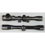 Two rifle scopes Apollo 4x32 and Tasco 3-9x32 with scope mounts.