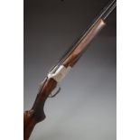 Browning B2G 12 bore over and under ejector shotgun with engraved scenes of birds to the lock,