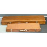 Two wooden shotgun or rifle hard carry cases, 115x29x11.5cm and 80x25x8cm.