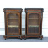 A pair of 19thC glazed, inlaid and ormolu mounted pier cabinets with breakfront column decoration,