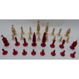A 19thC turned ivory chess set with one side stained red, height of king 13cm.
