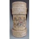 Canvas bound military shell carrier with armorial crest and leather handle.
