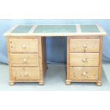 A pine leather inset twin pedestal desk, W136 x D70 x H77cm