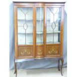 Edwardian inlaid mahogany glazed display cabinet with bow fronted decoration, raised on cabriole