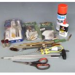 A collection of shotgun and rifle cleaning kit and accessories including Napier pull through kits,