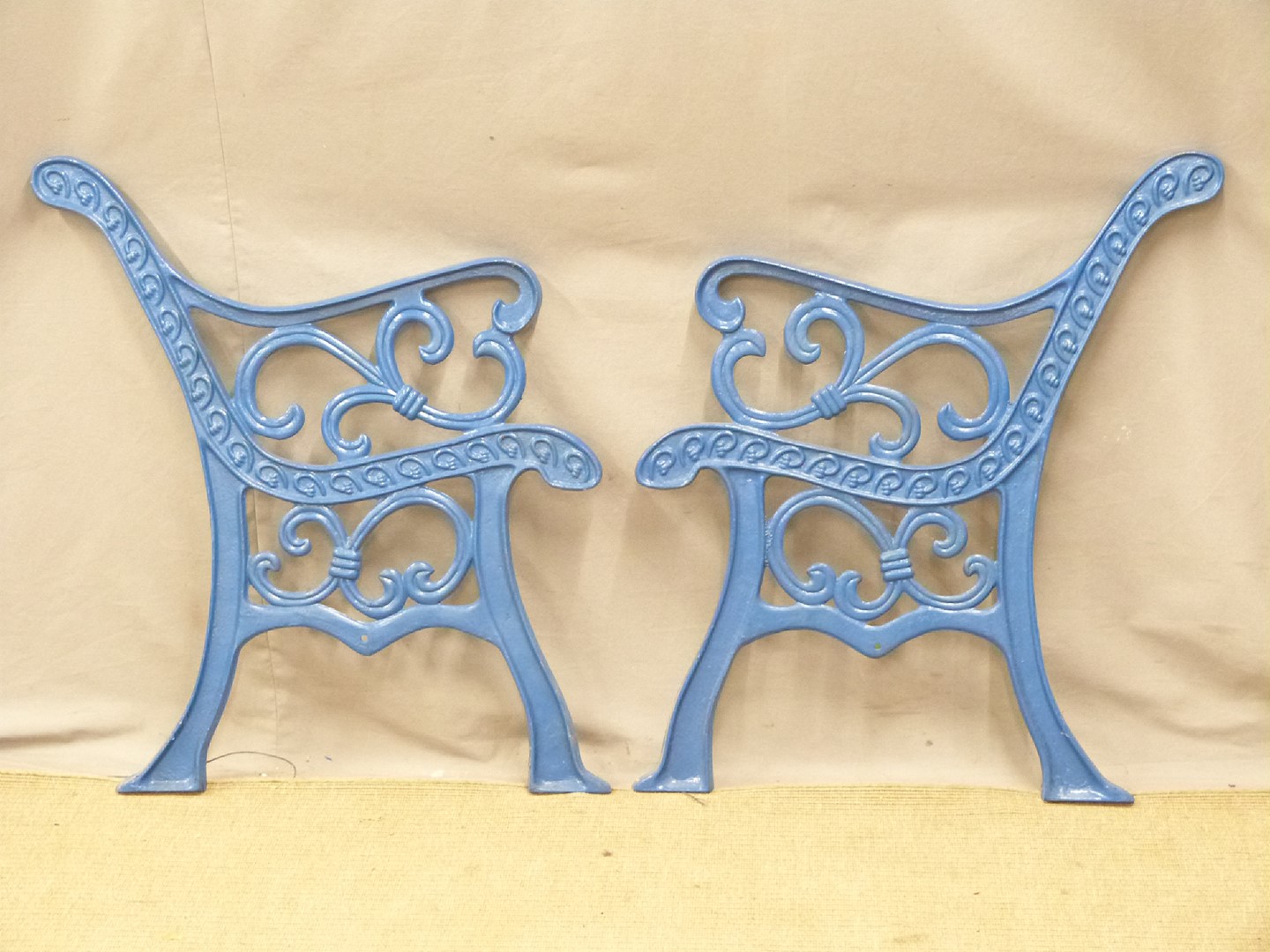 A pair of cast iron bench ends, H78cm