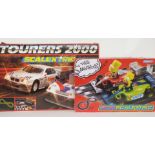 Two Hornby Scalextrix model motor racing sets Tourers 2000 C.673 and Micro Scalextric The Simpsons