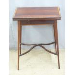 Rosewood fold over card table with inlaid decoration raised on tapering legs with swept inlaid