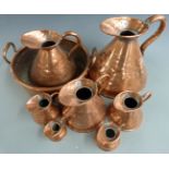 A set of seven 19thC copper measuring jugs from ½ gill to one Imperial gallon and a twin handled jam