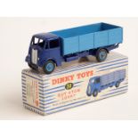 Dinky Toys diecast model Guy 4-Ton Lorry with dark blue body and chassis and light blue bed and