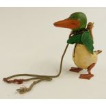 Schuco clockwork tinplate duck similar to Disney Donald Duck with green head, orange beak and