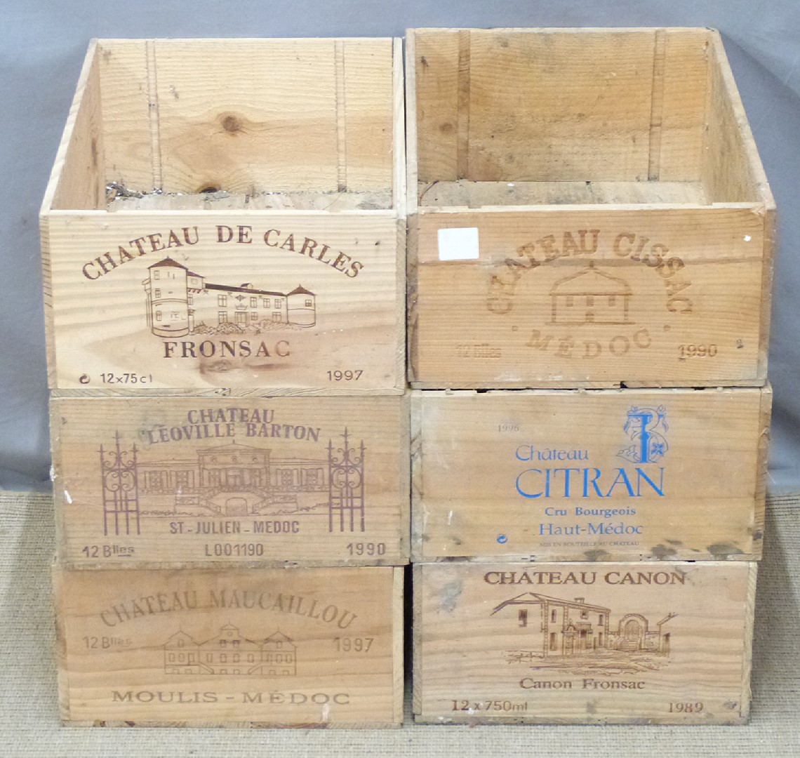 Six vintage wooden wine crates from various chateaux including  Cissac, Citran, Canon, De Carles,