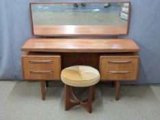 G Plan retro dressing table with two drawers to each side, together with a matching stool, W145,