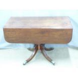 A 19th/20thC mahogany sofa table with single drawer and opposing dummy drawer raised on a turned