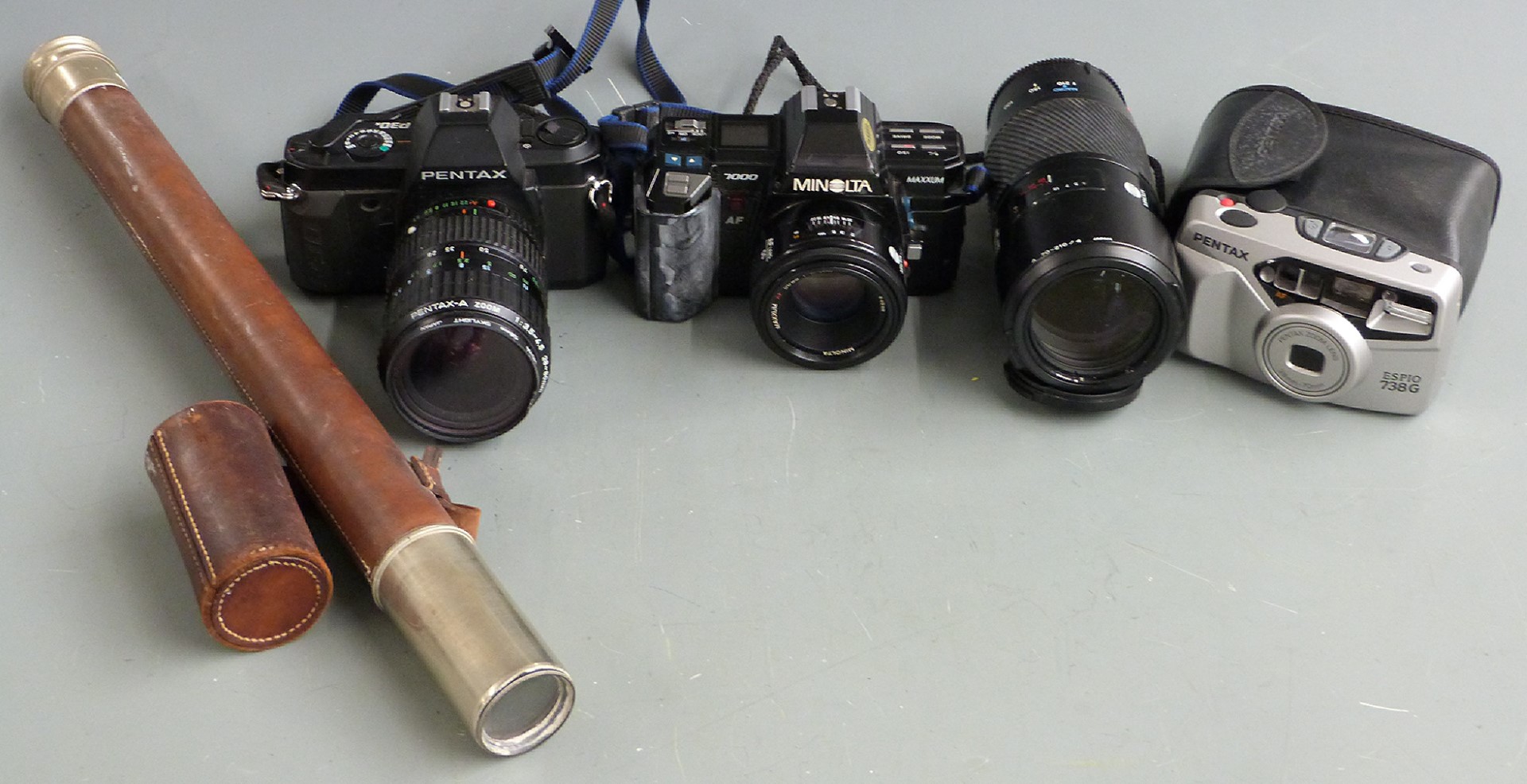 Two SLR cameras comprising Pentax P30N with 1:3.5-4.5 28-80mm lens and Minolta 7000 Maxxum with 50mm